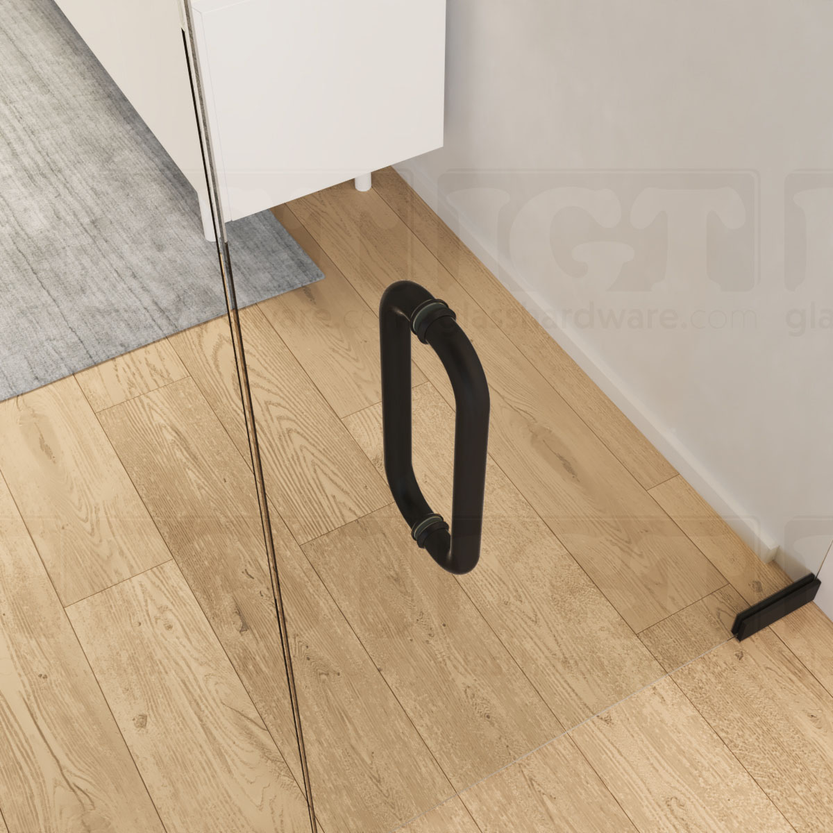 A close-up from above of the 12-inch Back-to-Back Round Pull Handle in Matte Black, installed on a commercial glass door.