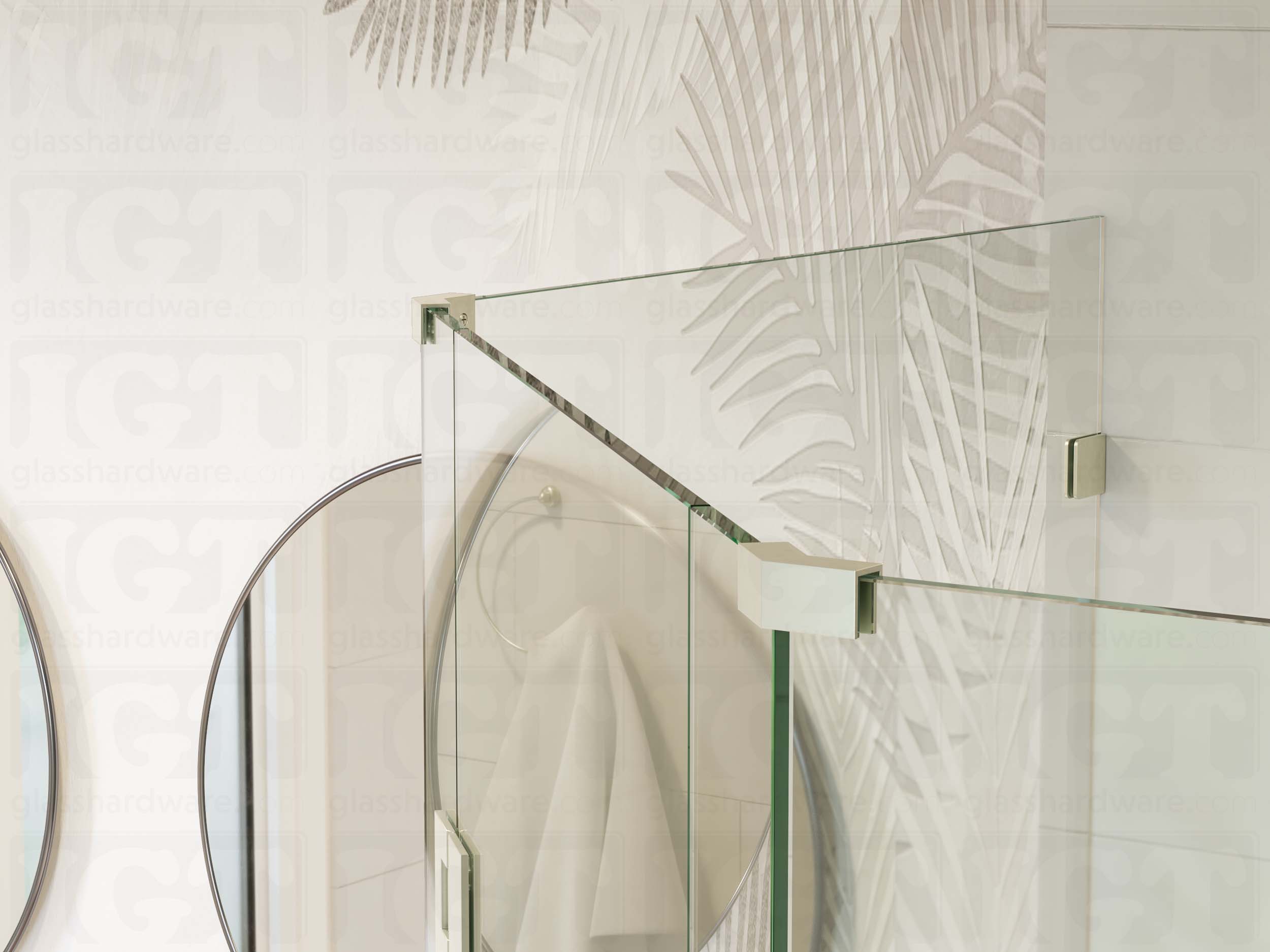 A top view of the neo angle shower enclosure secured by two Glass-to-Glass 135 Degree Sleeve Over Clamps. Their sleek design and Brushed Nickel finish complement the matching hinge and wall mounted clamp.