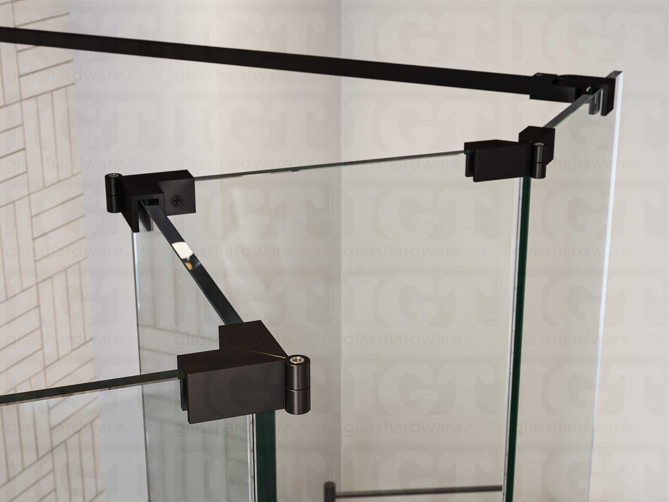 A close up of three Glass-to-Glass Adjustable Sleeve Over Clamps in Oil Rubbed Bronze installed on a doorless glass shower enclosure alongside a matching support bar.