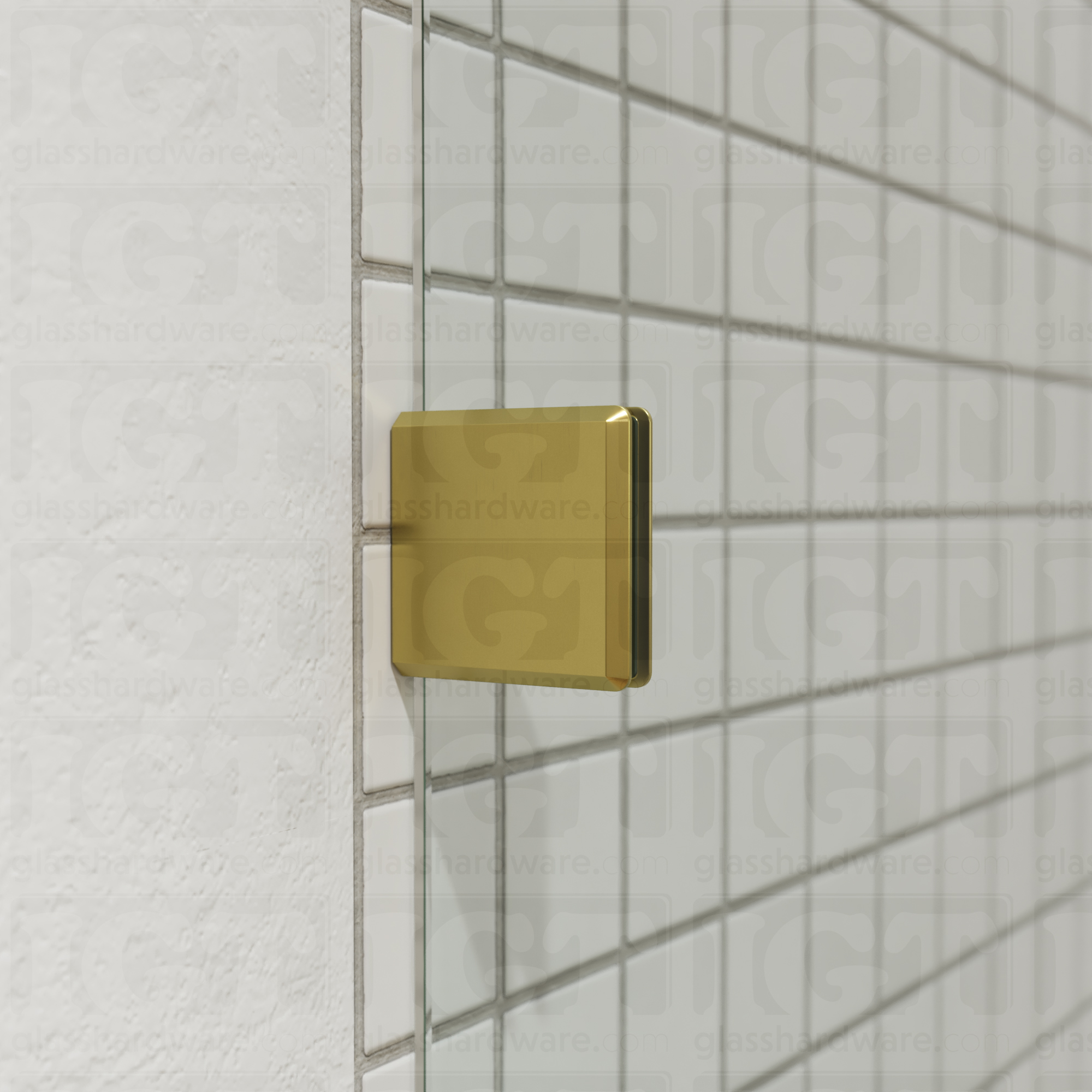 A close-up of an Oversized Wall-to-Glass Bilboa Clamp mounted to the shower's tile wall. The clamp is securely holding the shower's fixed glass panel in place. Gold Brushed.