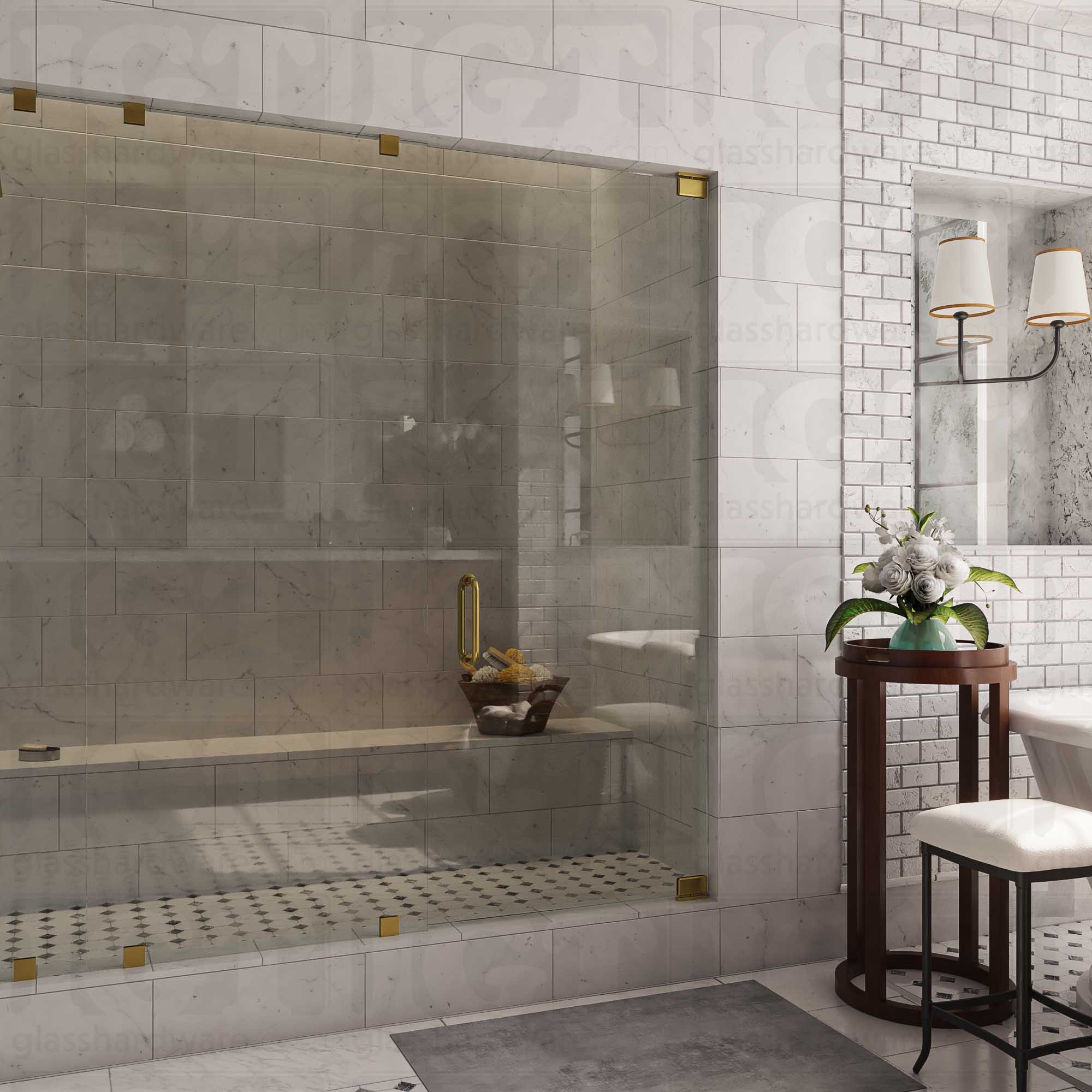 An elegant bathroom interior featuring a glass shower enclosure with two Top and Bottom Bilboa Pivot Hinges for the shower door. The space has a marble-tiled shower with a built-in bench. Soft, ambient lighting highlights the luxurious finishes, creating a warm and sophisticated atmosphere. Gold Brushed.