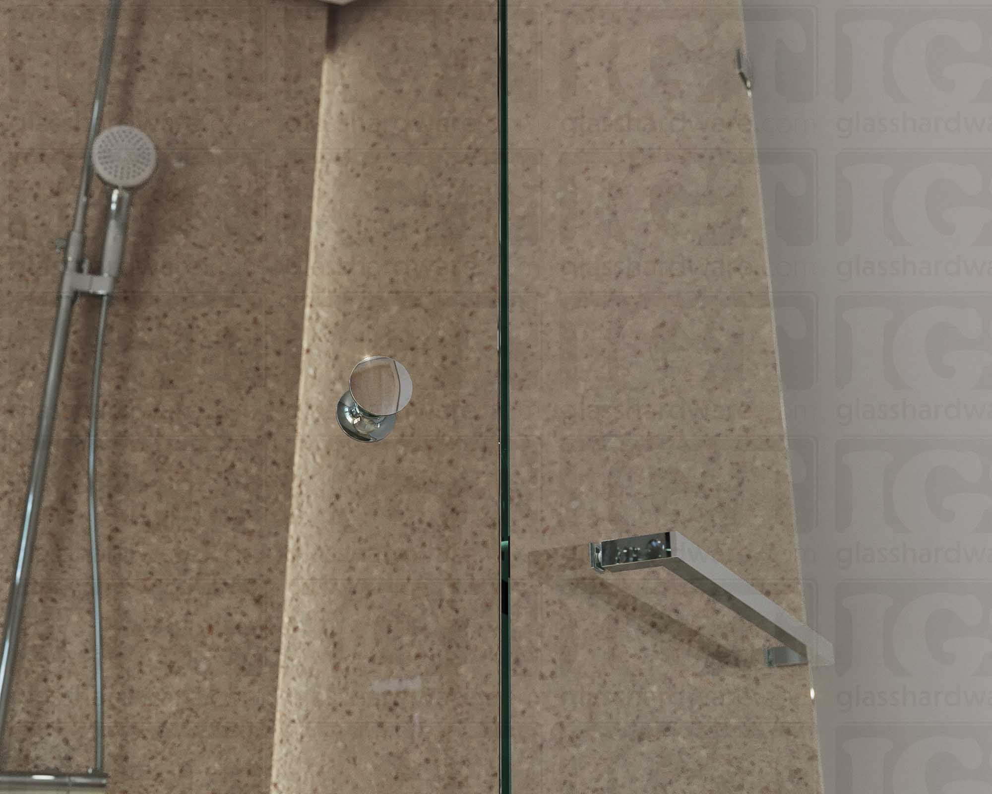 A close up of the Traditional Style Back-to-Back Door Knob installed on a glass shower door. Chrome Polished.