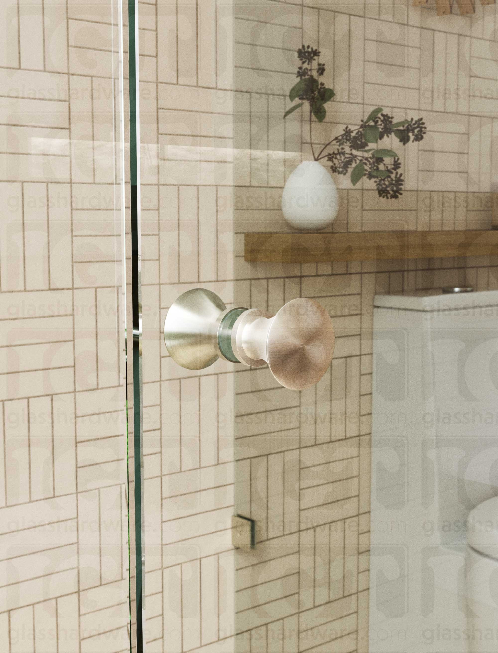 A close up of the Junior Traditional Back-to-Back Door Knob installed on a glass shower door. The door knob's back-to-back design is tightly secured to the glass door. Brushed Nickel.
