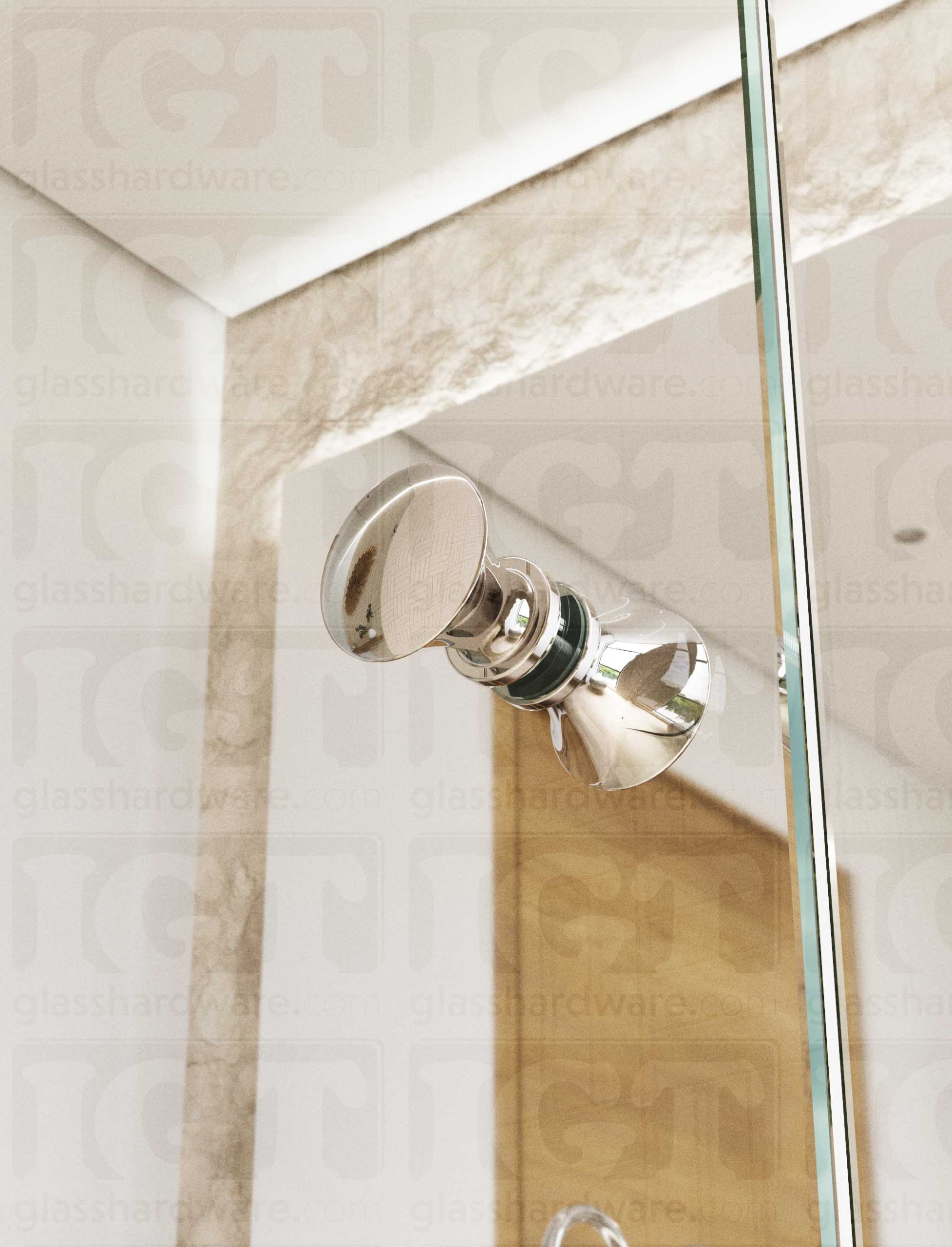A close up from below of the Junior Traditional Back-to-Back Door Knob installed on a glass shower door. Soft natural light highlights the knob's Chrome Polished finish.