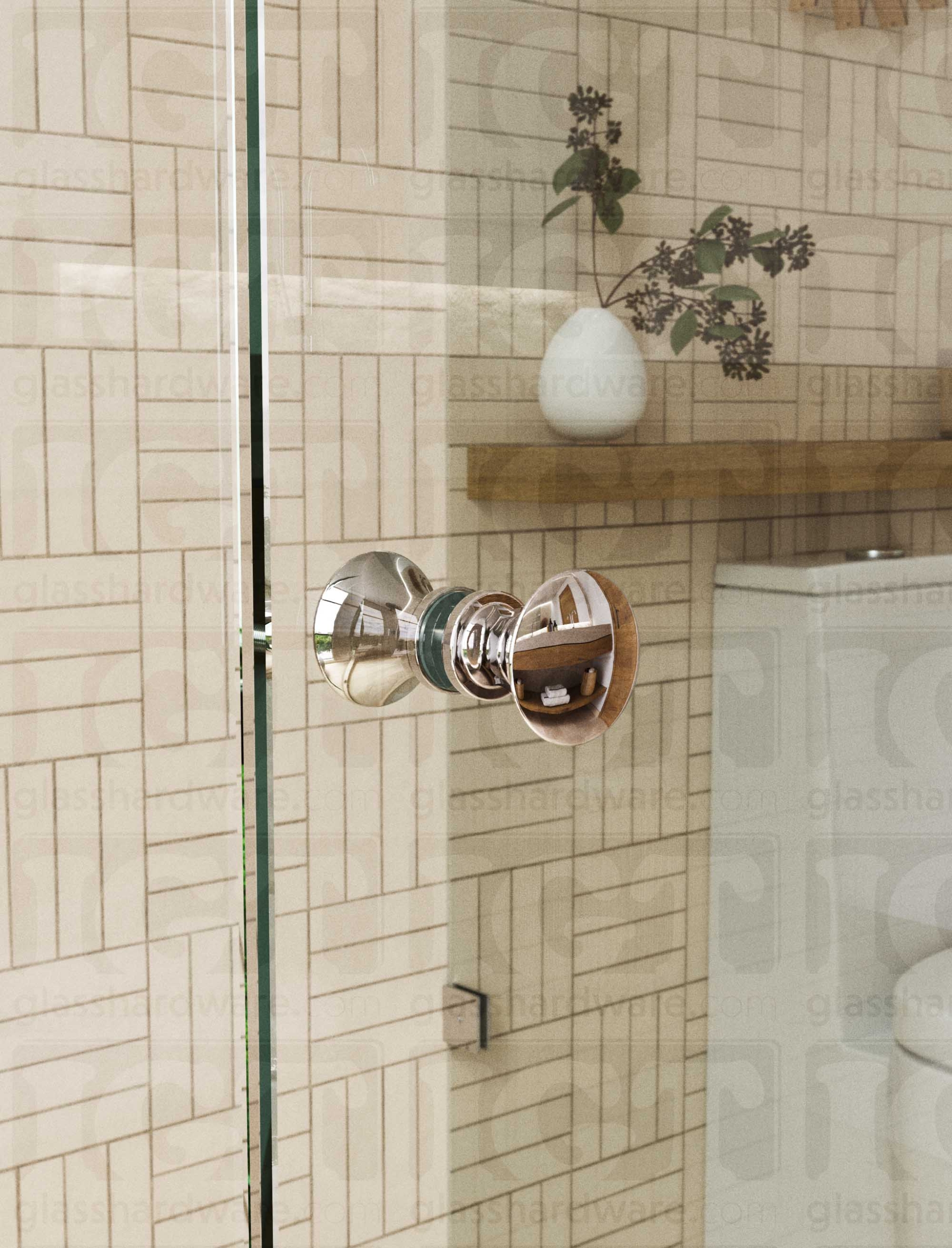 A close up of the Junior Traditional Back-to-Back Door Knob installed on a glass shower door. The door knob's back-to-back design is tightly secured to the glass door. Chrome Polished.
