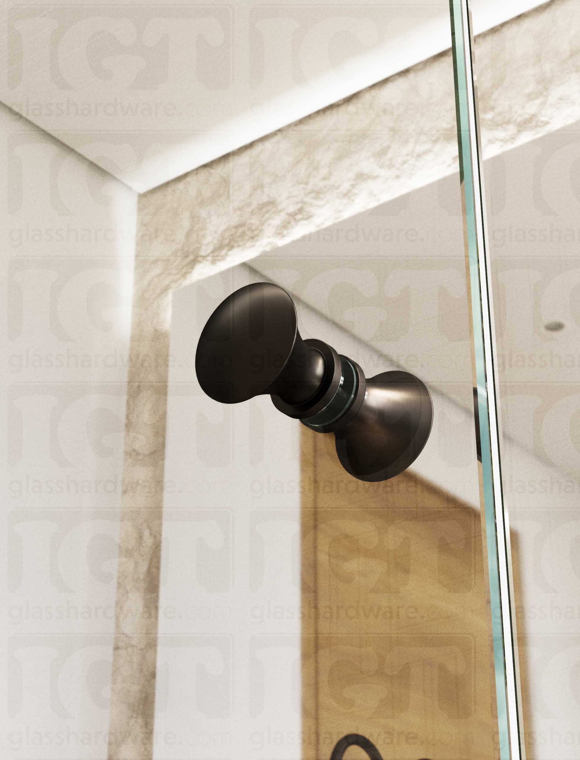 A close up from below of the Junior Traditional Back-to-Back Door Knob installed on a glass shower door. Soft natural light highlights the knob's Oil Rubbed Bronze finish.