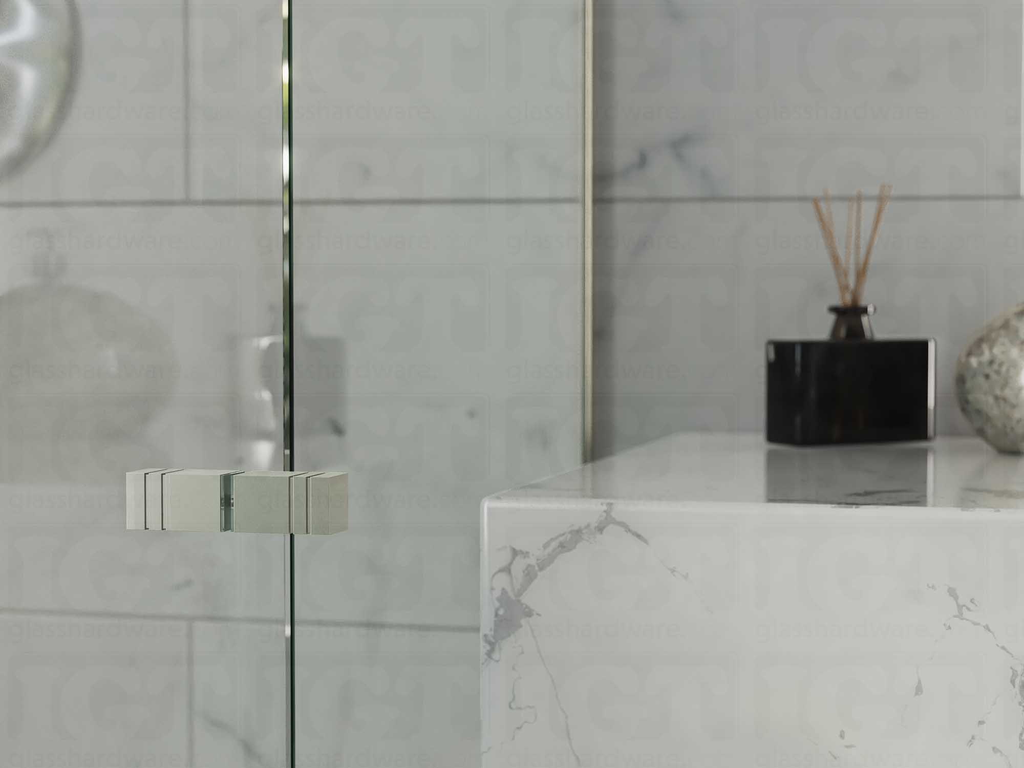 A close up of the Square Back-to-Back Door Knob installed on a glass shower door. Brushed Nickel.