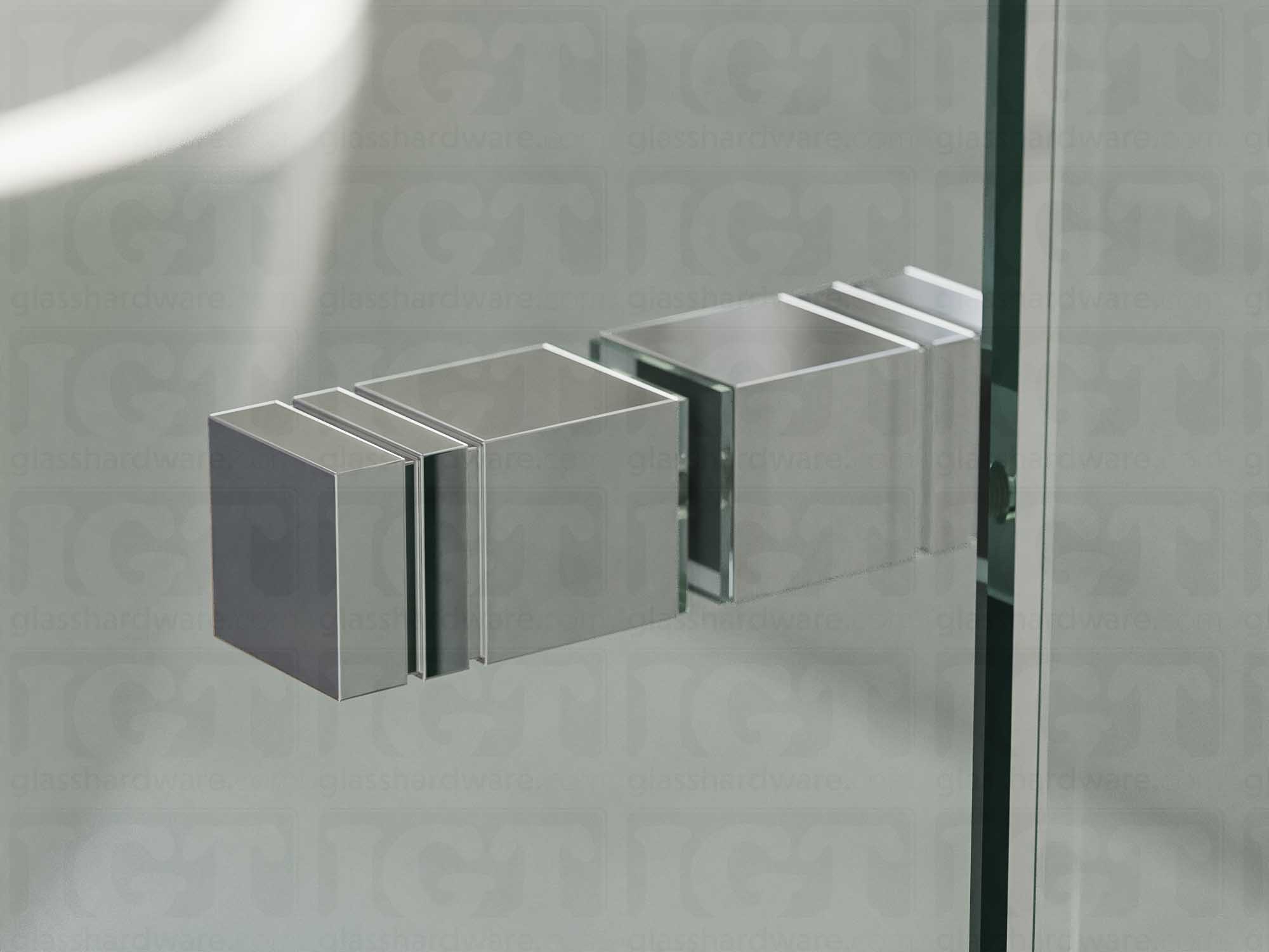 A close up of the Square Back-to-Back Door Knob installed on a glass shower door. Soft natural light highlights the knob's Chrome Polished finish.