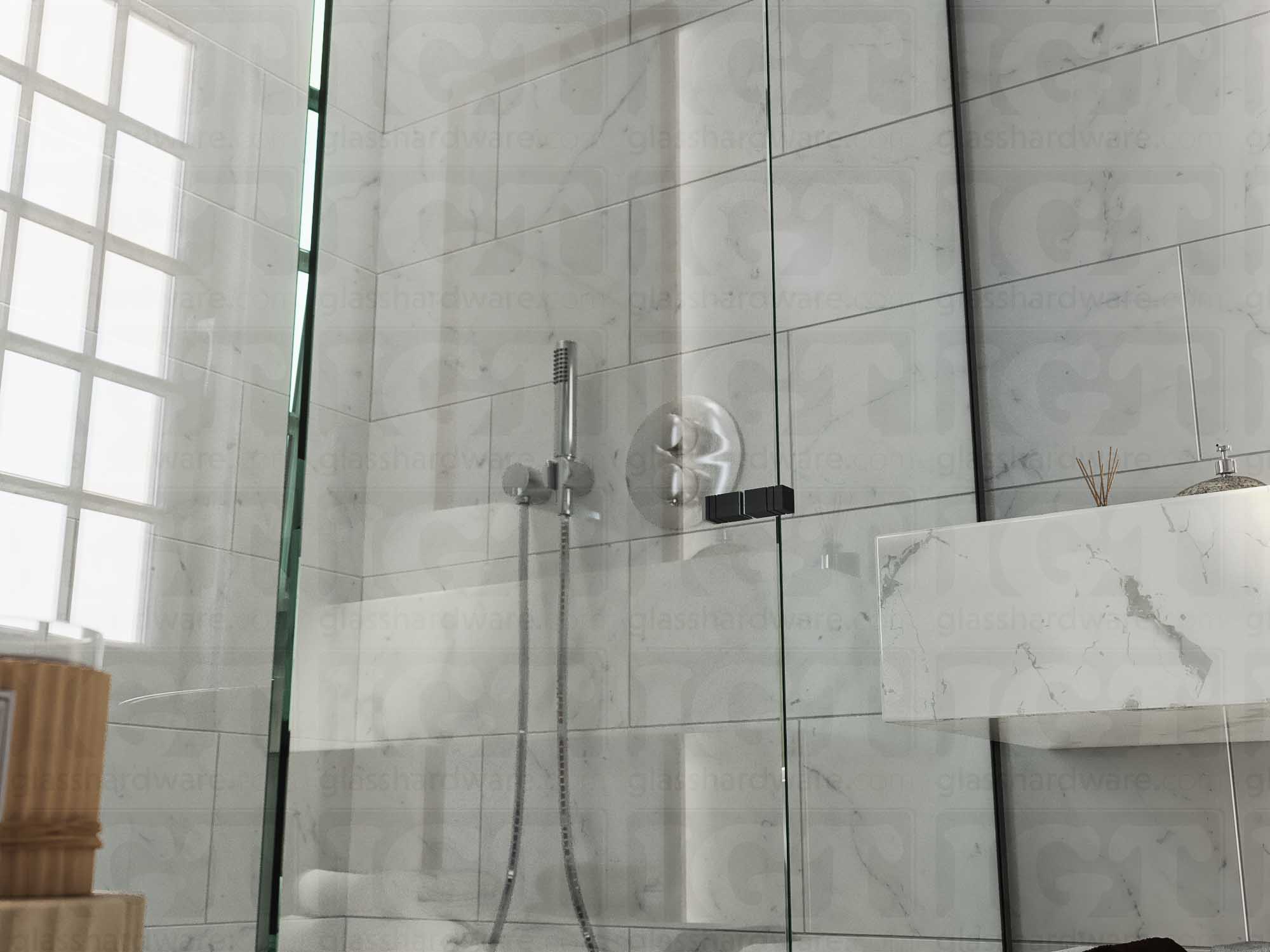 A close up of the Square Back-to-Back Door Knob installed on a glass shower door. The door knob's back-to-back design is tightly secured to the glass door. Matte Black.