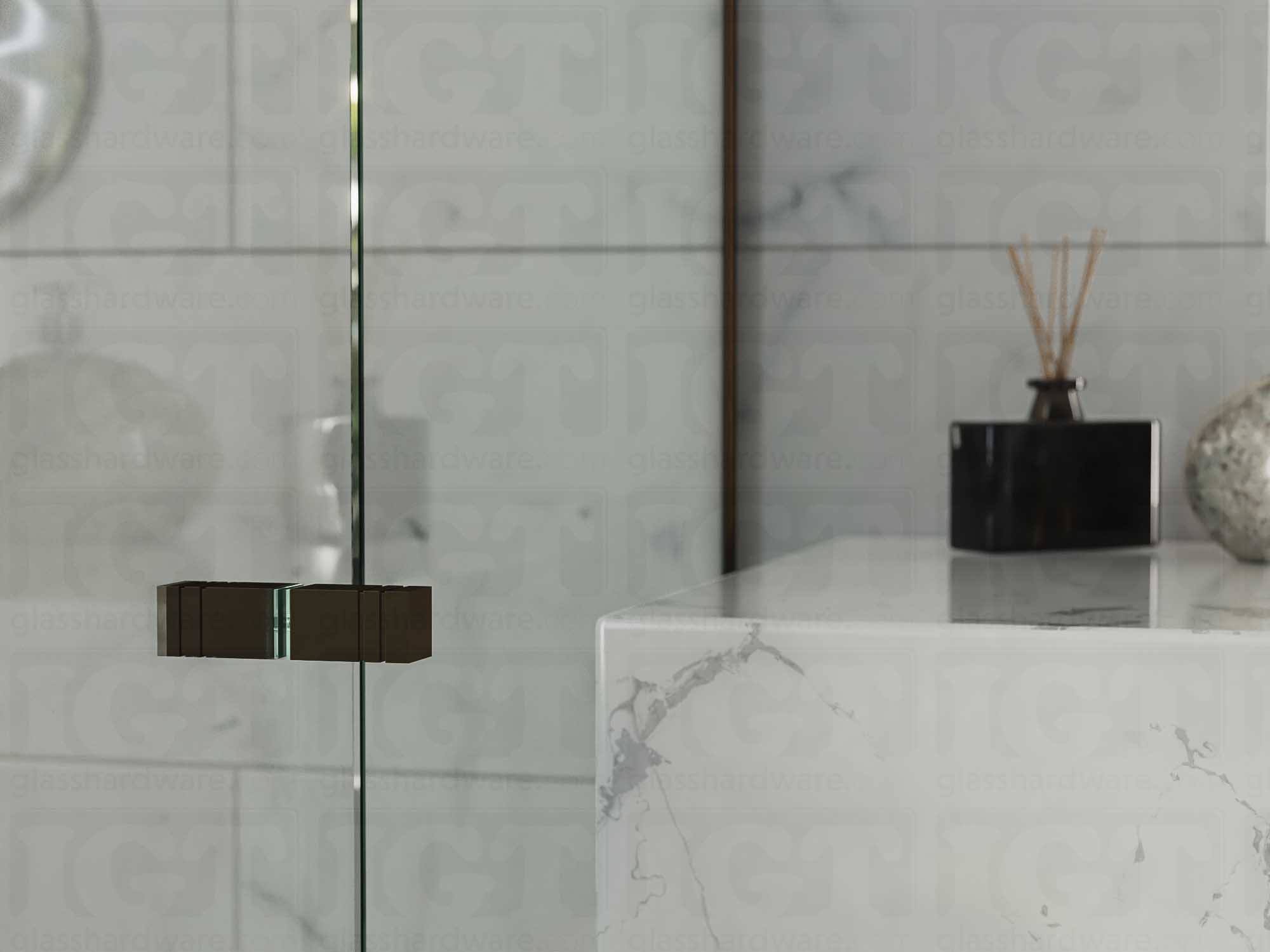 A close up of the Square Back-to-Back Door Knob installed on a glass shower door. Oil Rubbed Bronze.