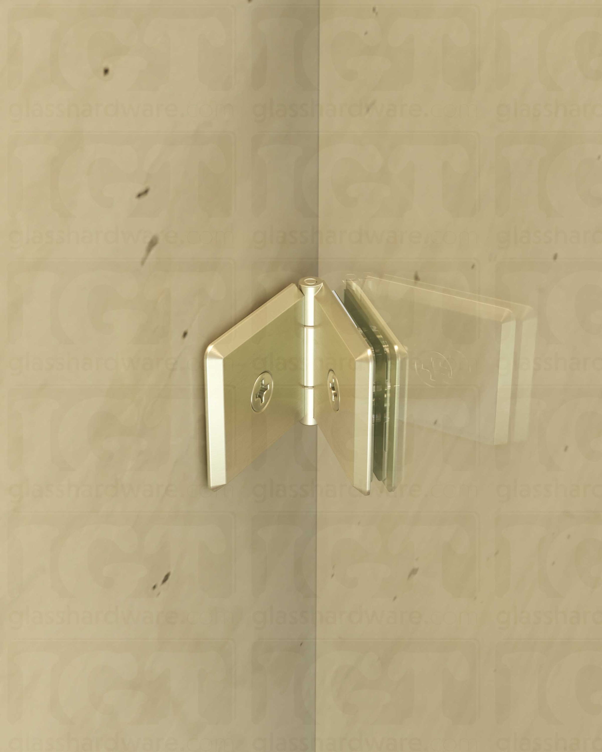 A close-up view of the Glass-to-Glass Adjustable Bilboa Clamp, installed on a shower enclosure. The clamp's Solid Brass construction provides a secure and durable mount for the shower's fixed panel. Brushed Nickel.