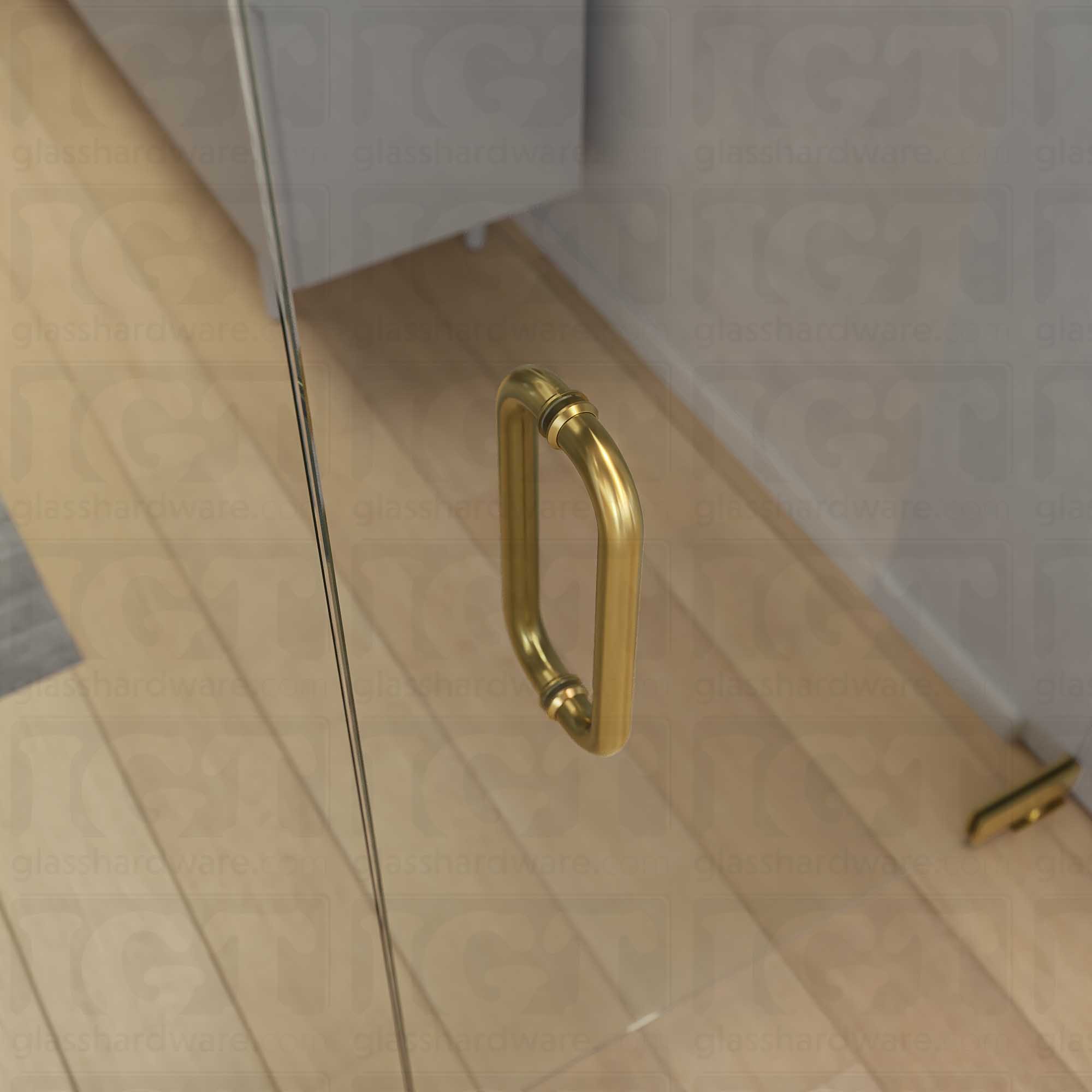 A close-up from above of the 12-inch Back-to-Back Round Pull Handle in Gold Brushed, installed on a commercial glass door.