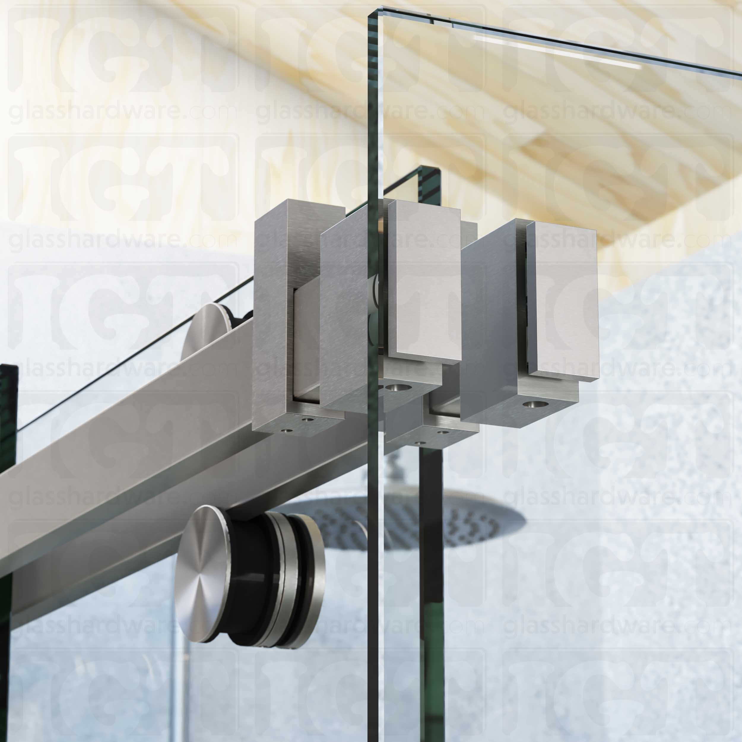 A close up view of the 90 Degree Connectors fixed to the return panel and joined to the sliding system's track. Brushed Stainless.