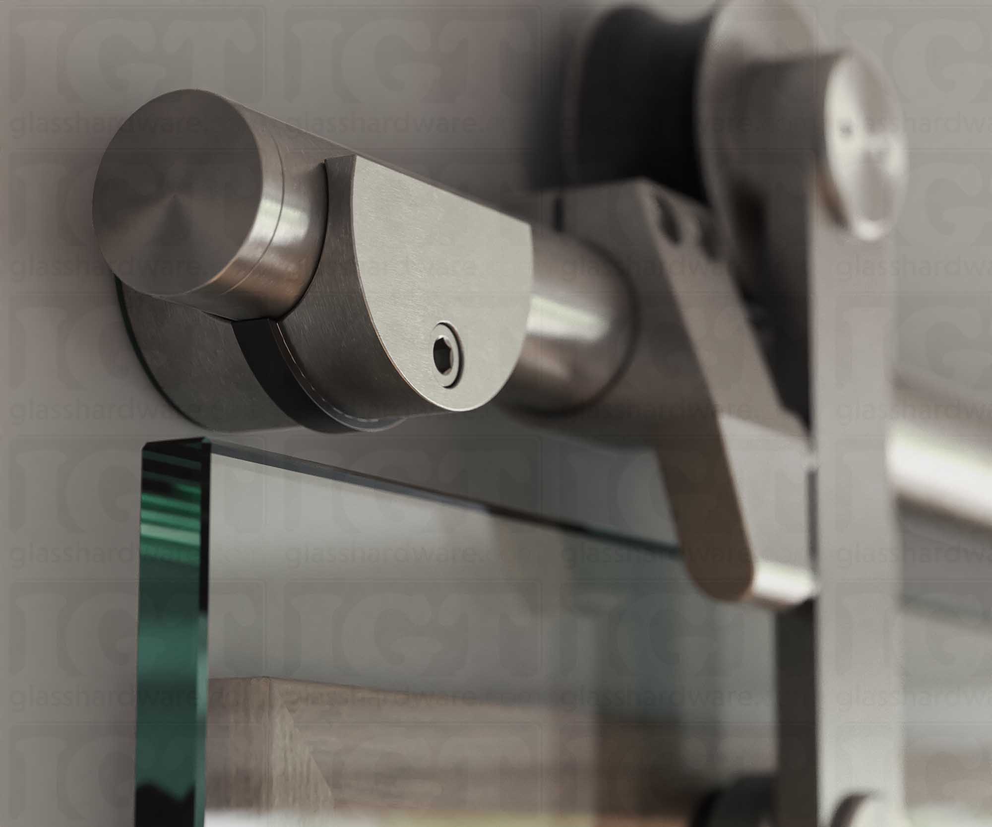 A close up of the Wall Mount Bracket, tightened to securely hold the barn door's upper track. Brushed Stainless.