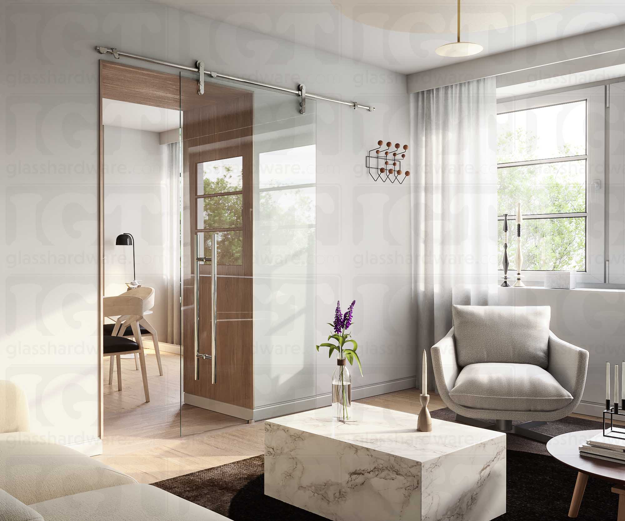 A modern living room featuring a glass barn door installed with four Wall Mount Brackets. Polished Stainless.