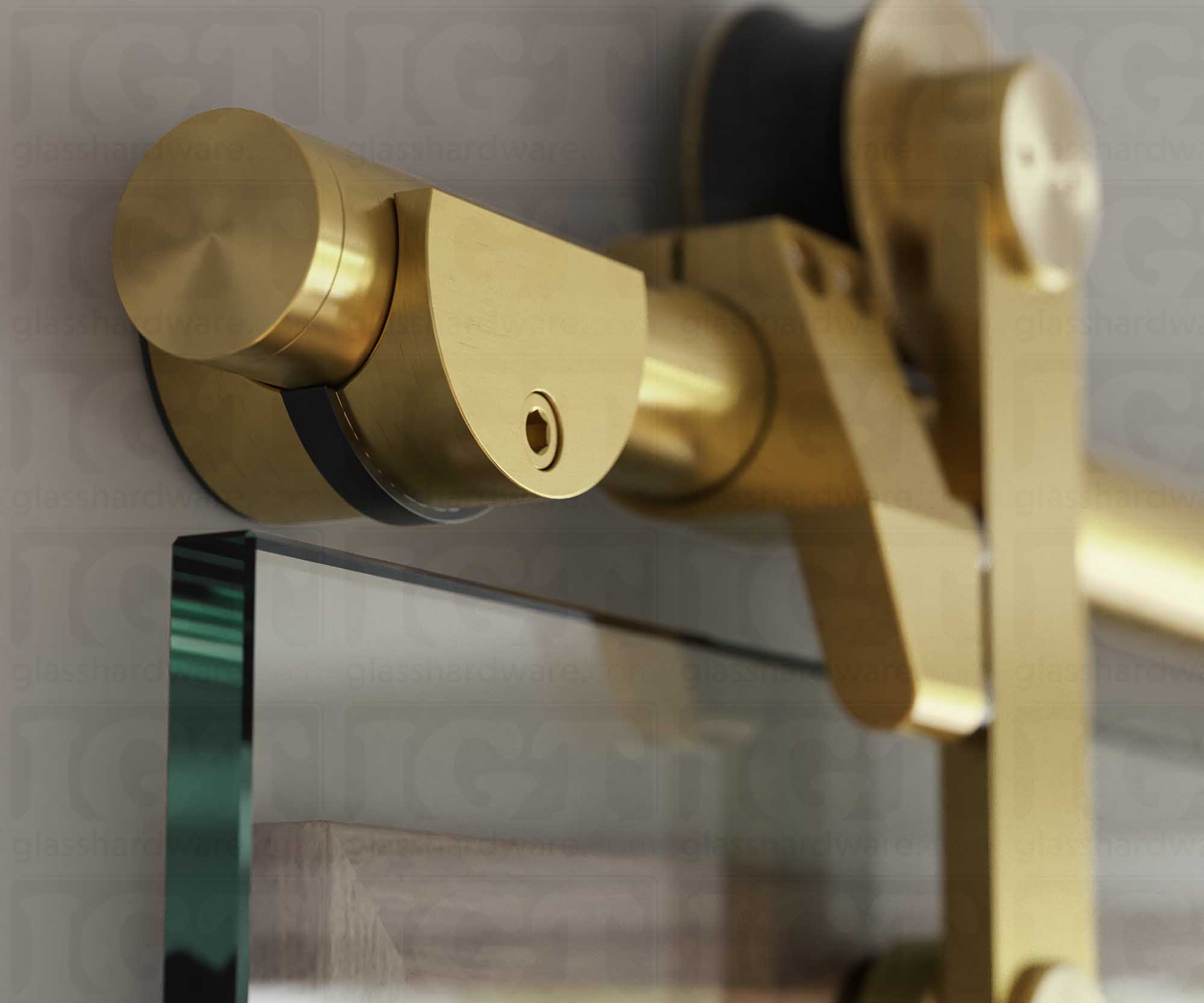 A close up of the Wall Mount Bracket, tightened to securely hold the barn door's upper track. Gold Brushed.