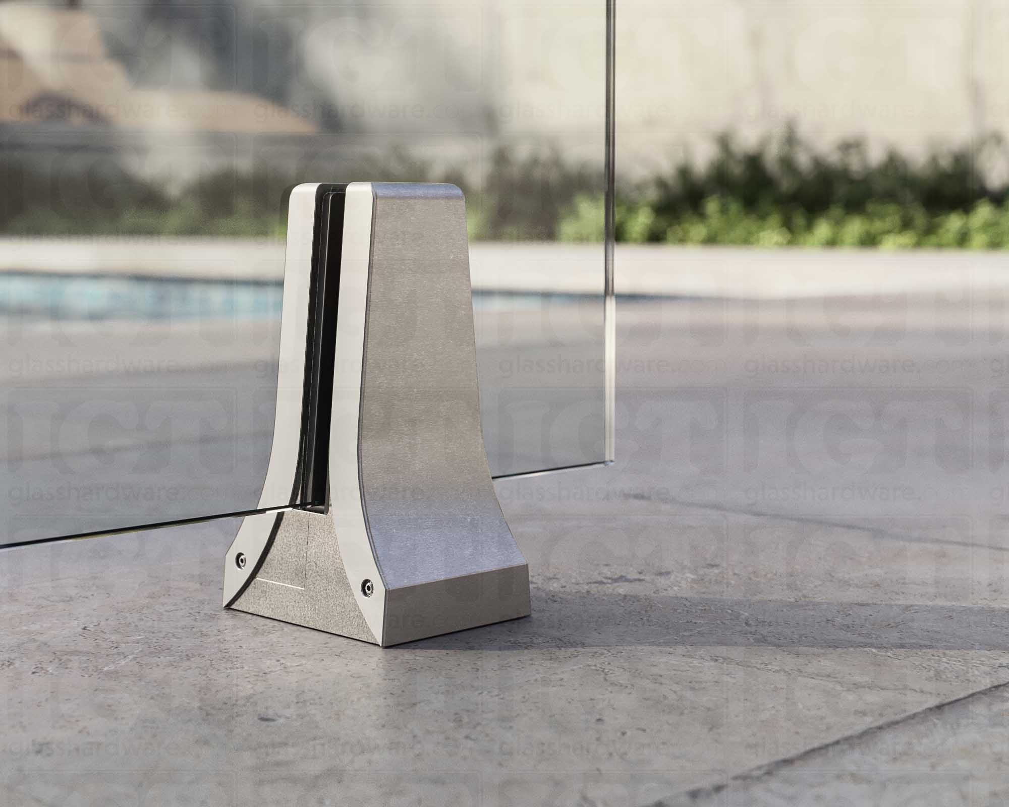 A close up of the 316L Stainless Steel Chameleon Spigot supporting a glass railing system. Brushed Stainless.
