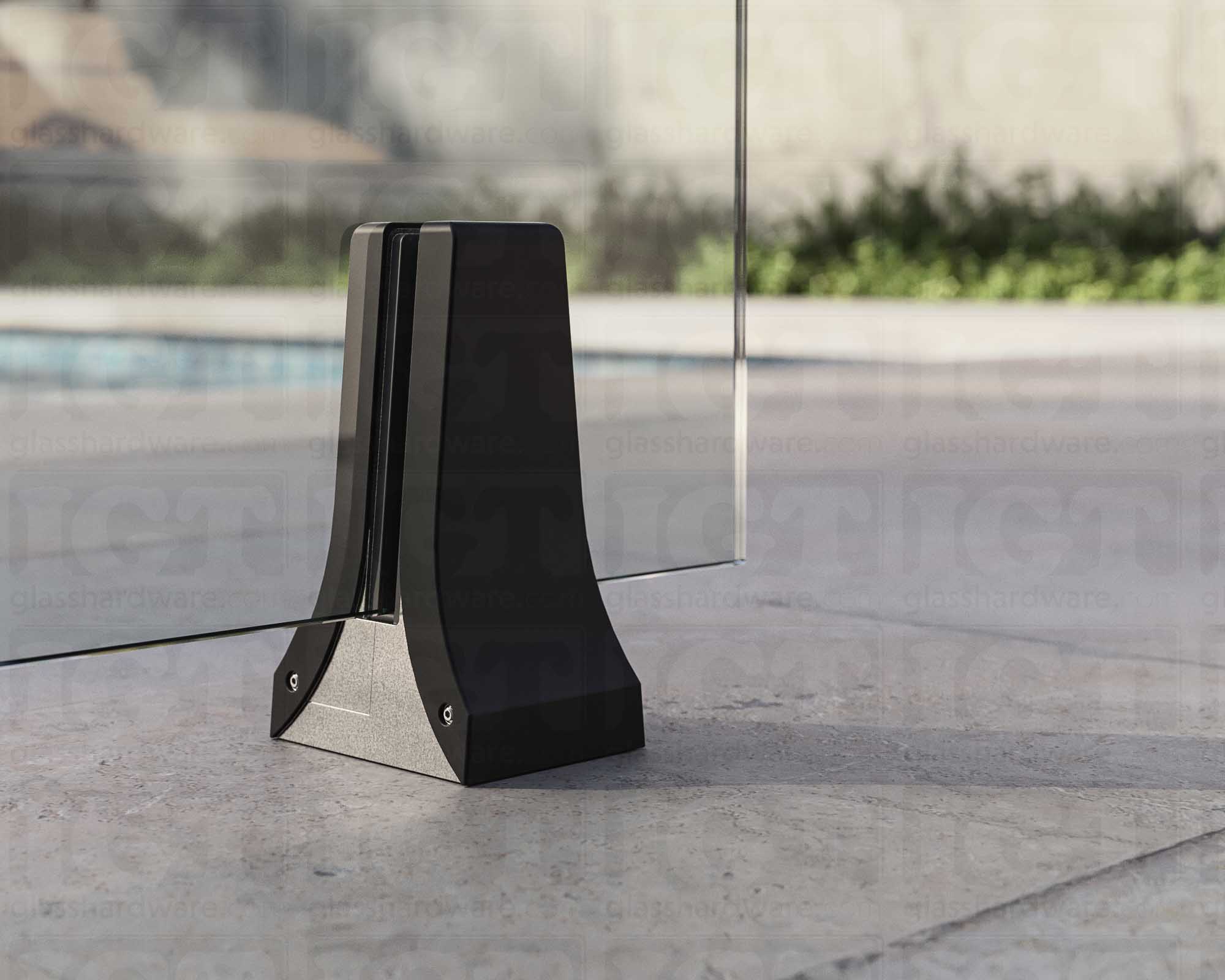 A close up of the 316L Stainless Steel Chameleon Spigot supporting a glass railing system. Matte Black.