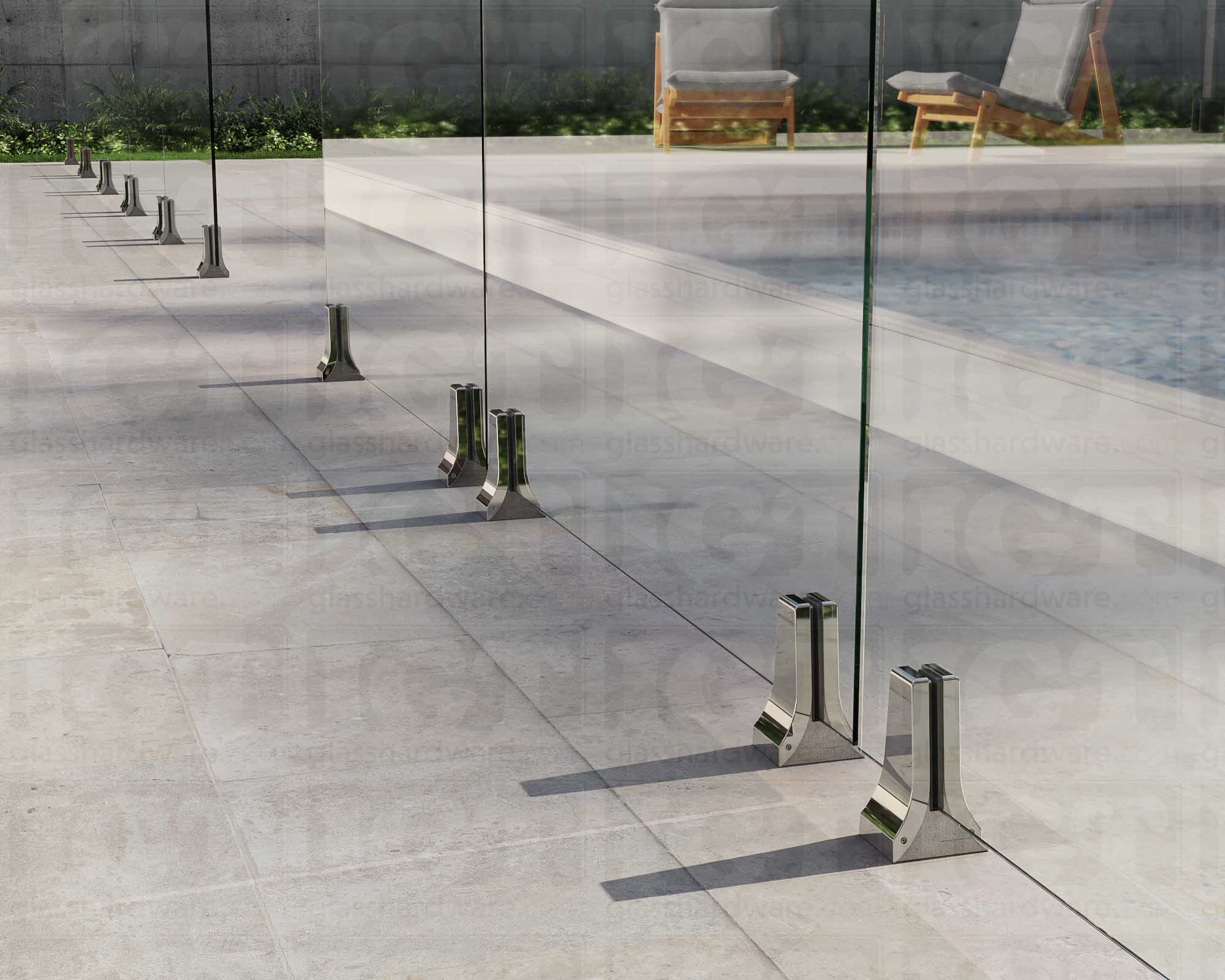 Several 316L Stainless Steel Chameleon Spigots installed to support a poolside glass railing system. Polished Stainless.