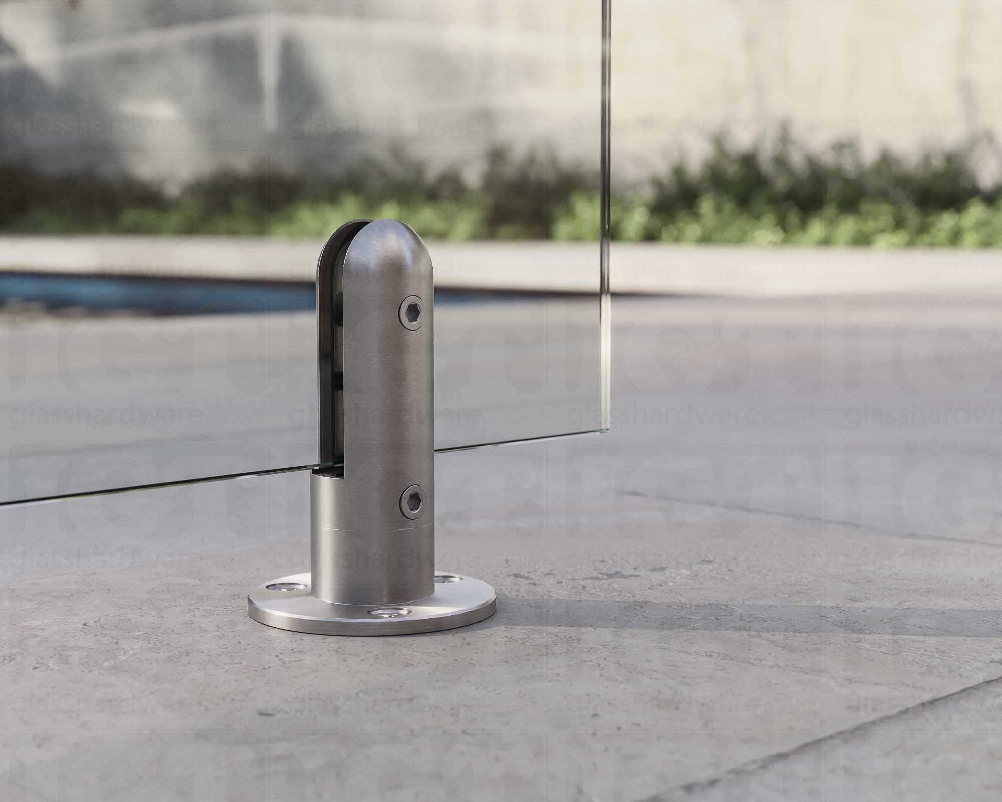 A close up of the 316L Stainless Steel Round Spigot supporting a glass railing system. Brushed Stainless.