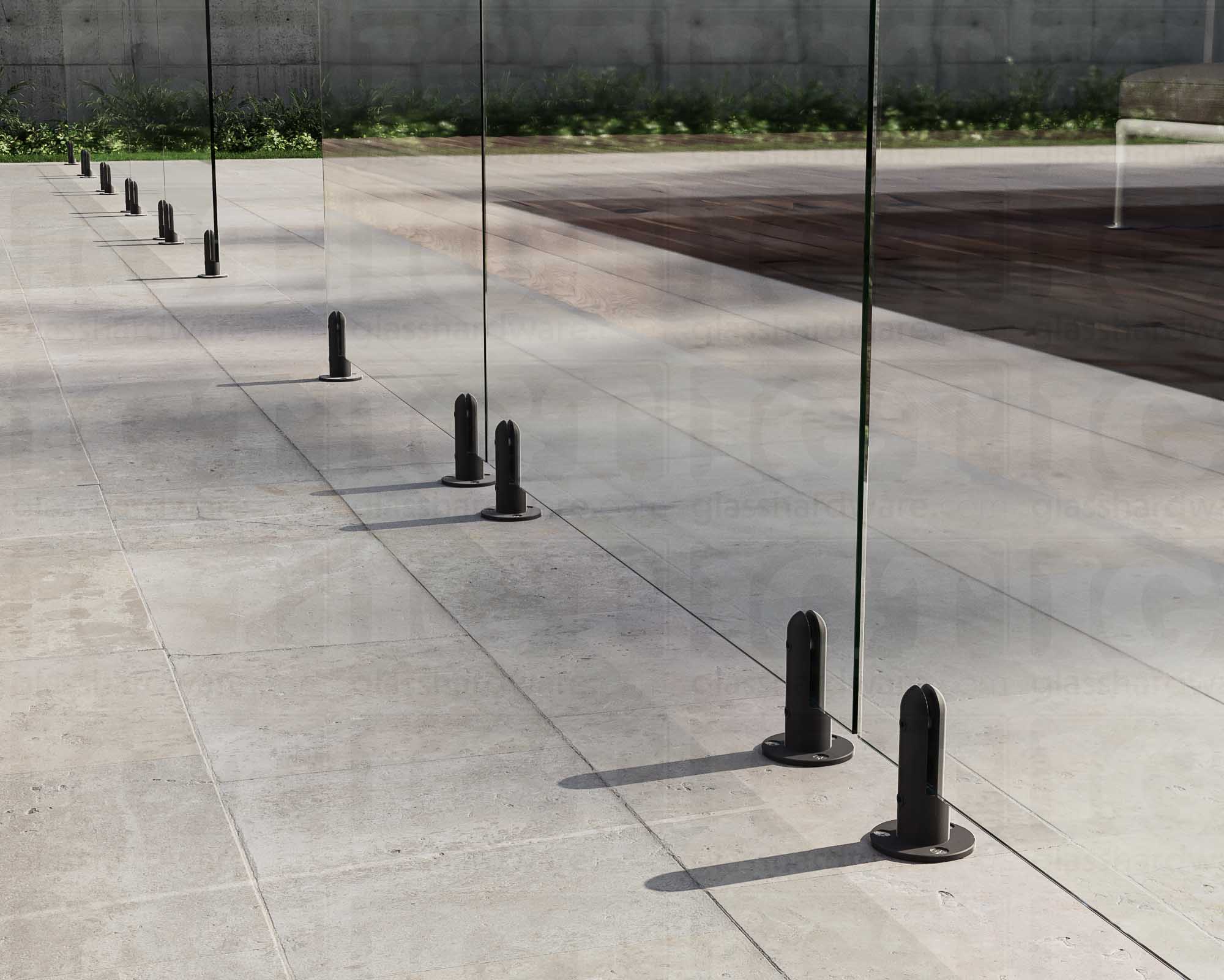 Several 316L Stainless Steel Round Spigots installed to support a poolside glass railing system. Matte Black.