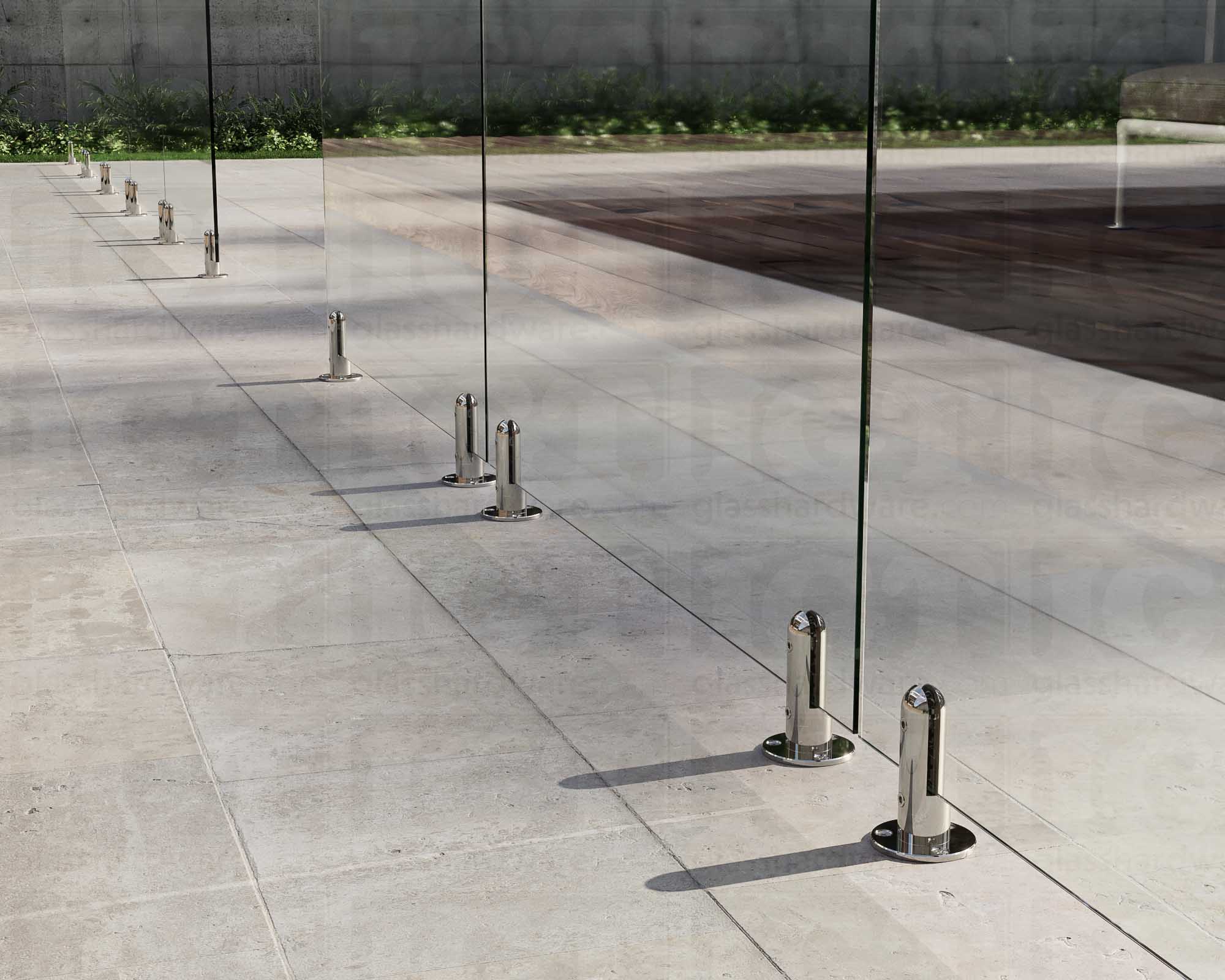 Several 316L Stainless Steel Round Spigots installed to support a poolside glass railing system. Polished Stainless.