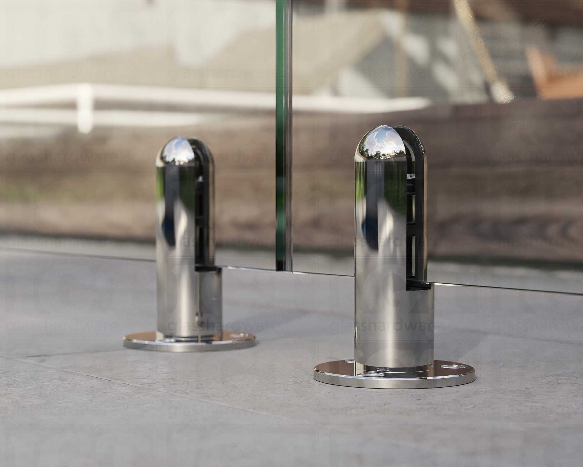 A close up of two 316L Stainless Steel Round Spigots supporting a glass railing system. Polished Stainless.