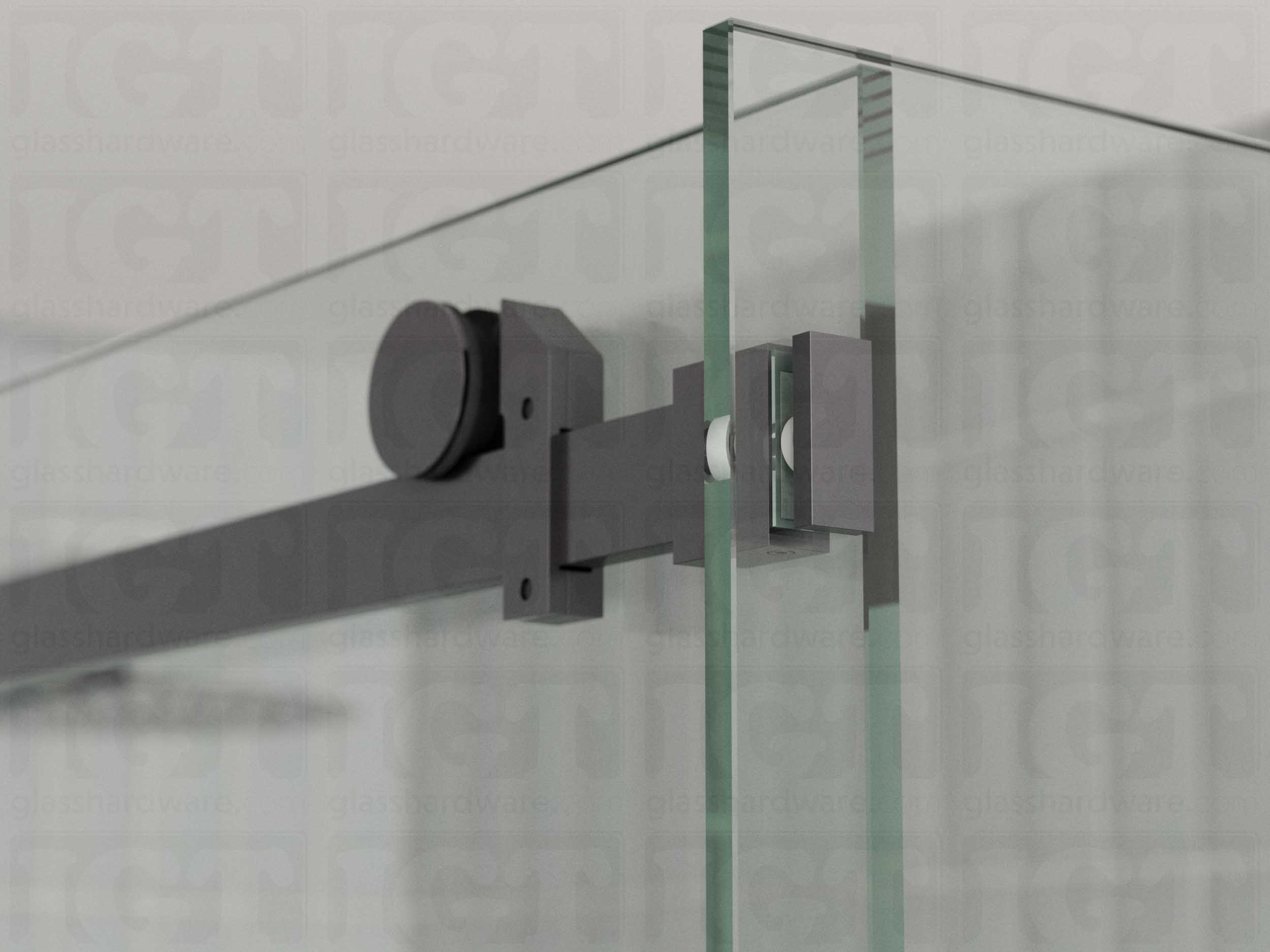 A close up view of the 90 Degree Connector fixed to the return panel and joined to the sliding door system's track. Polished Gun Metal.