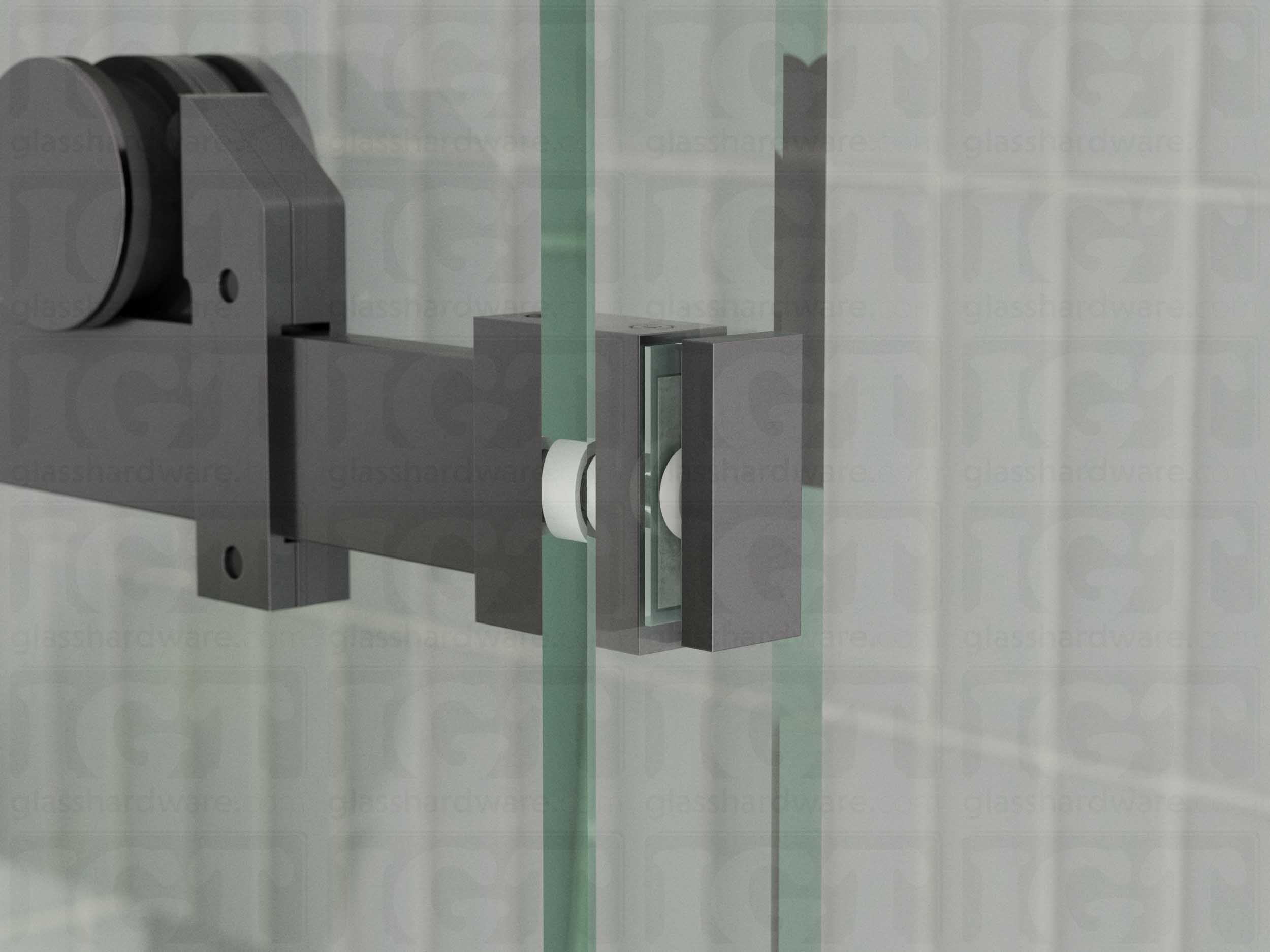 A close up view of the 90 Degree Connector installed on a sliding shower door system. Polished Gun Metal.