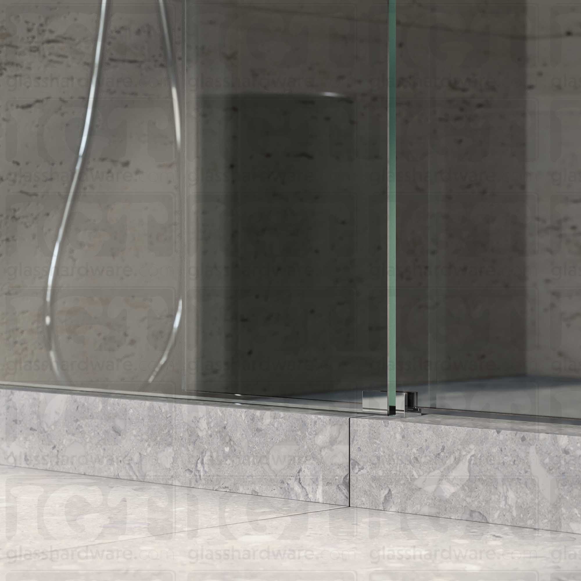 A close up of the Floor Guide for Modern Sliding System installed at the base of a glass sliding door. Chrome Polished.