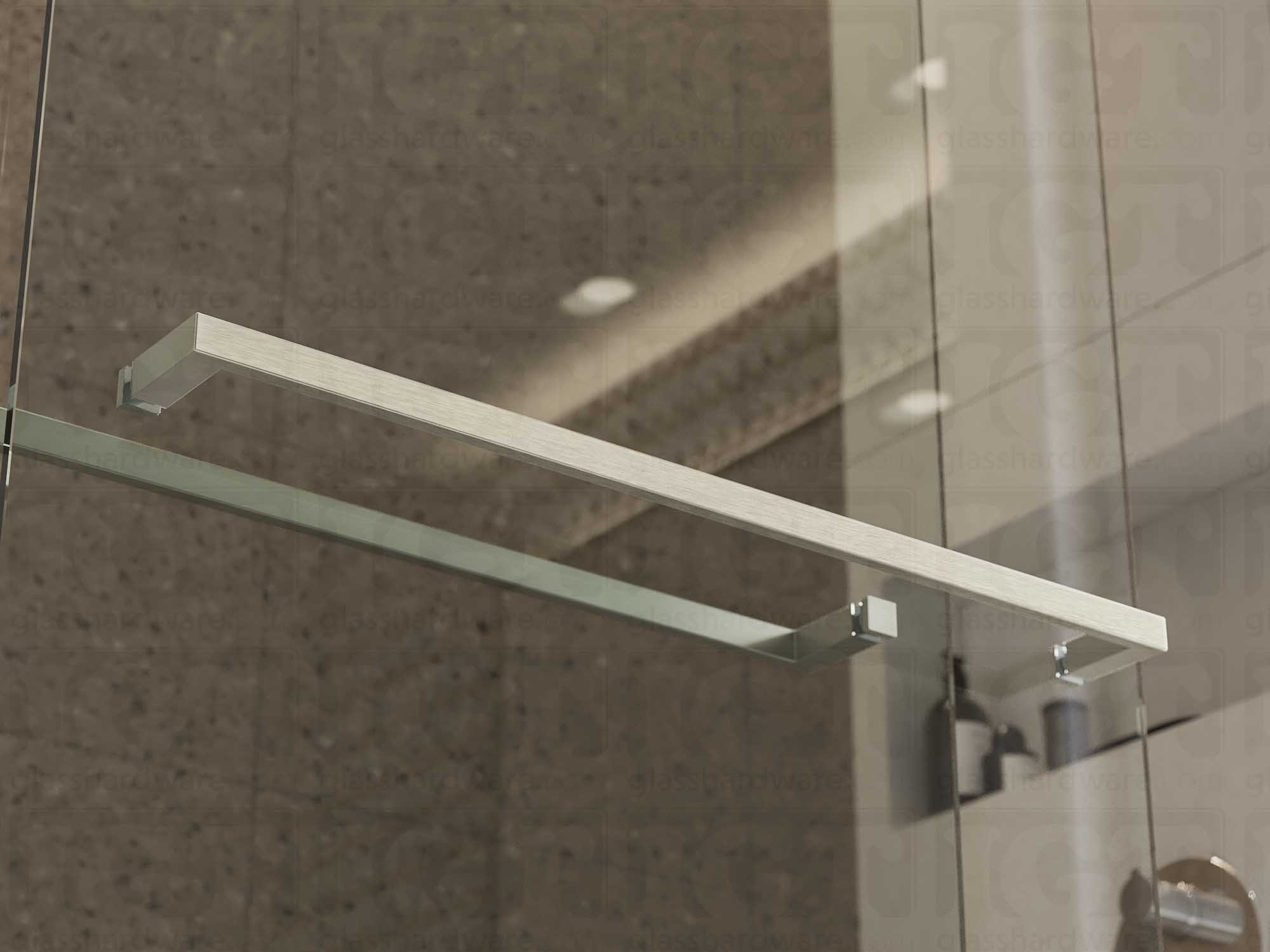 The 24" Slim Single-Sided Square Towel Bars installed on a glass shower door. Natural light reflects off its sleek Aluminum construction. Brushed Stainless.