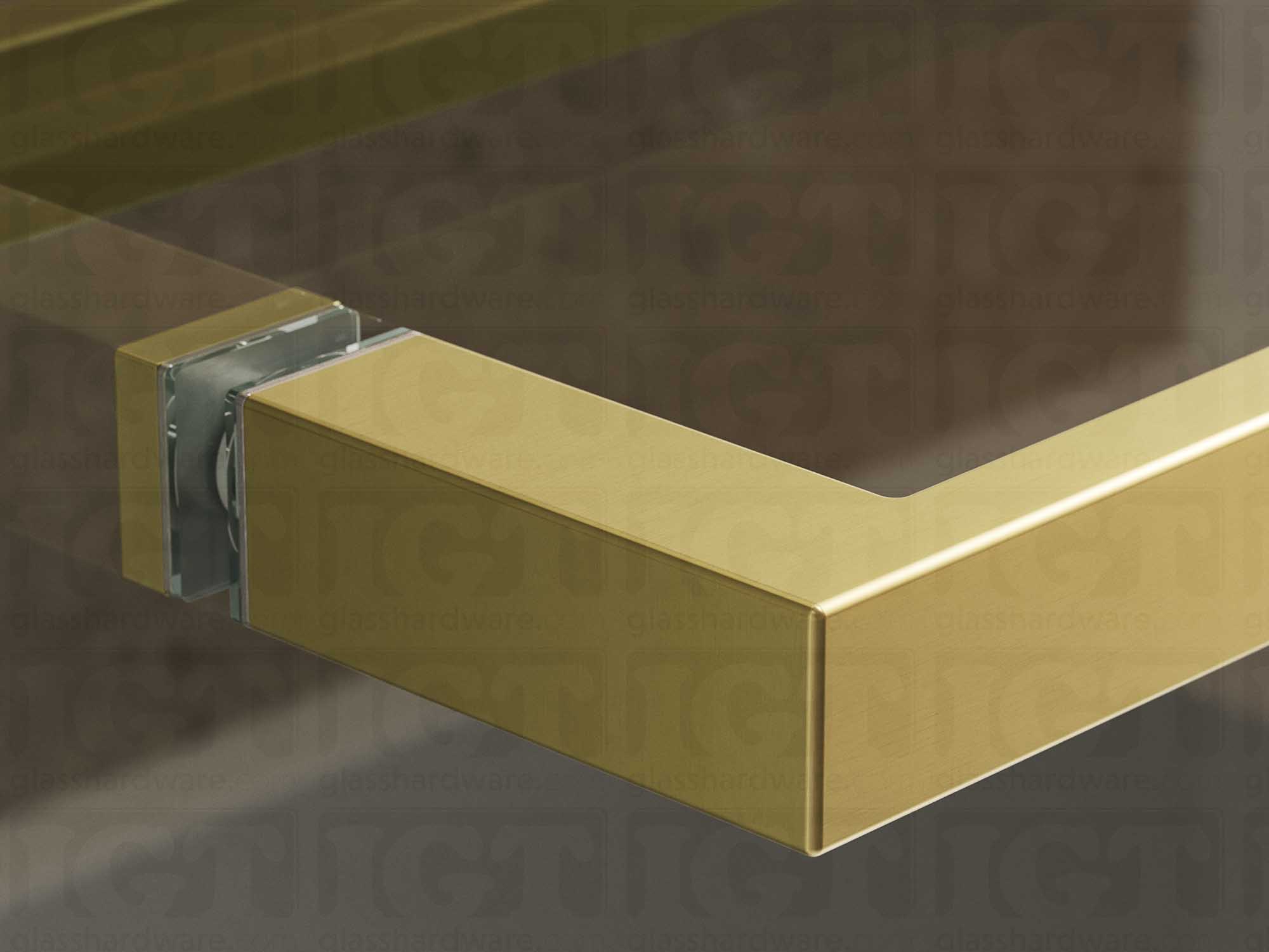 A close up of the 24" Slim Single-Sided Square Towel Bar installed on a glass sliding shower door, showcasing its Gold Brushed finish.