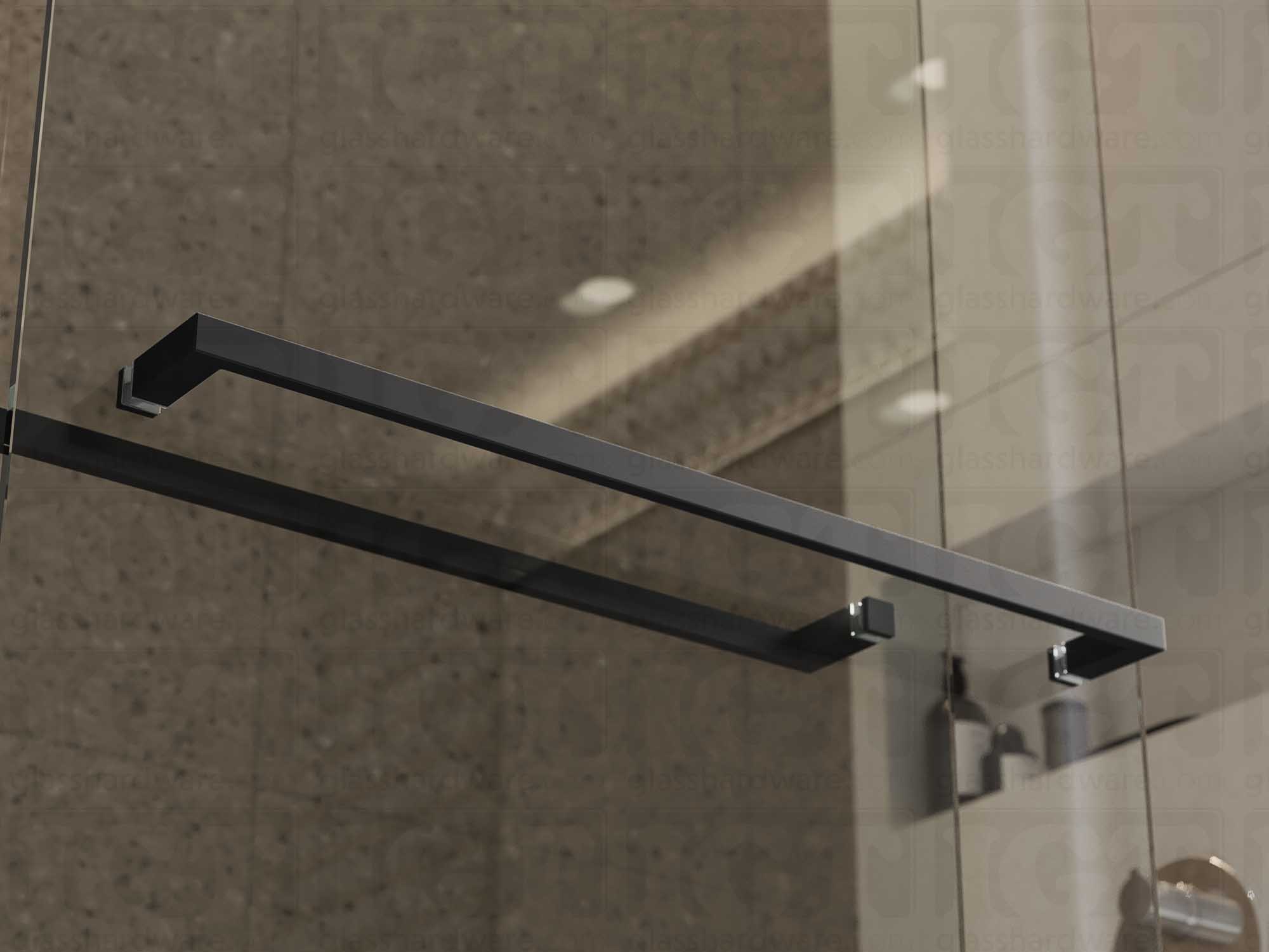 The 24" Slim Single-Sided Square Towel Bars installed on a glass shower door. Natural light reflects off its sleek Aluminum construction. Matte Black.